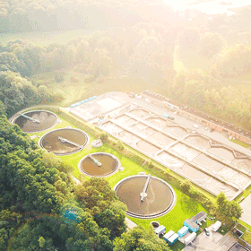 An aerial photo of clarifiers and settling tanks at a wastewater treatment plant
